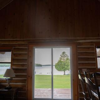 Living room with sliding doors open to the lake
